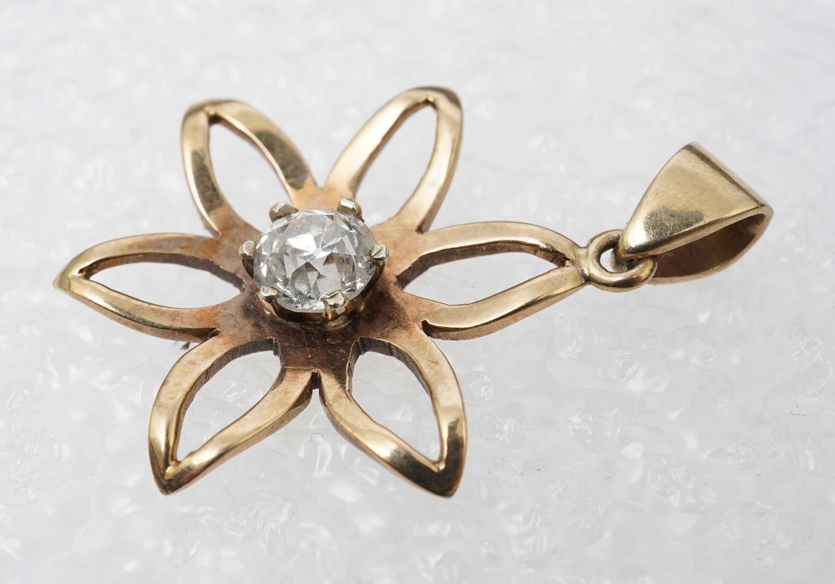 A gold and diamond pendant, mid 20th century